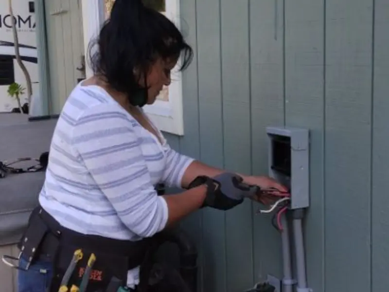 Licensed electrician wiring an exterior subpanel in Bedminster